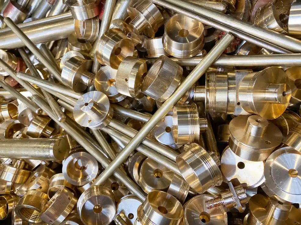 Worker weighing brass taps and fittings scrap on calibrated scale in Sydney